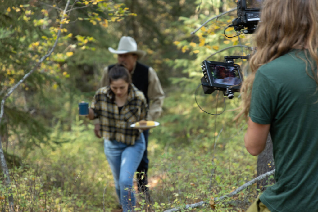 Production still: Annie and Rob on set